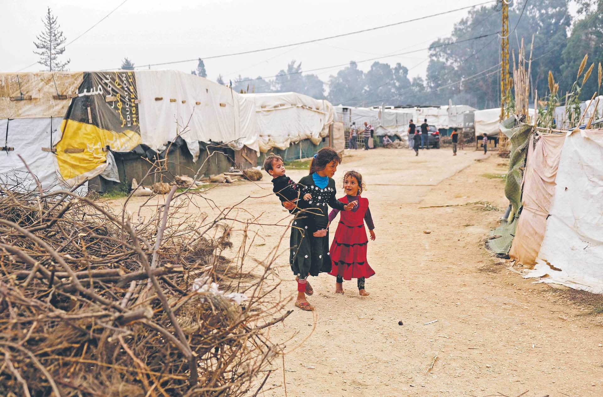 Syryjscy uchodźcy w obozie Tal Haja w Libanie