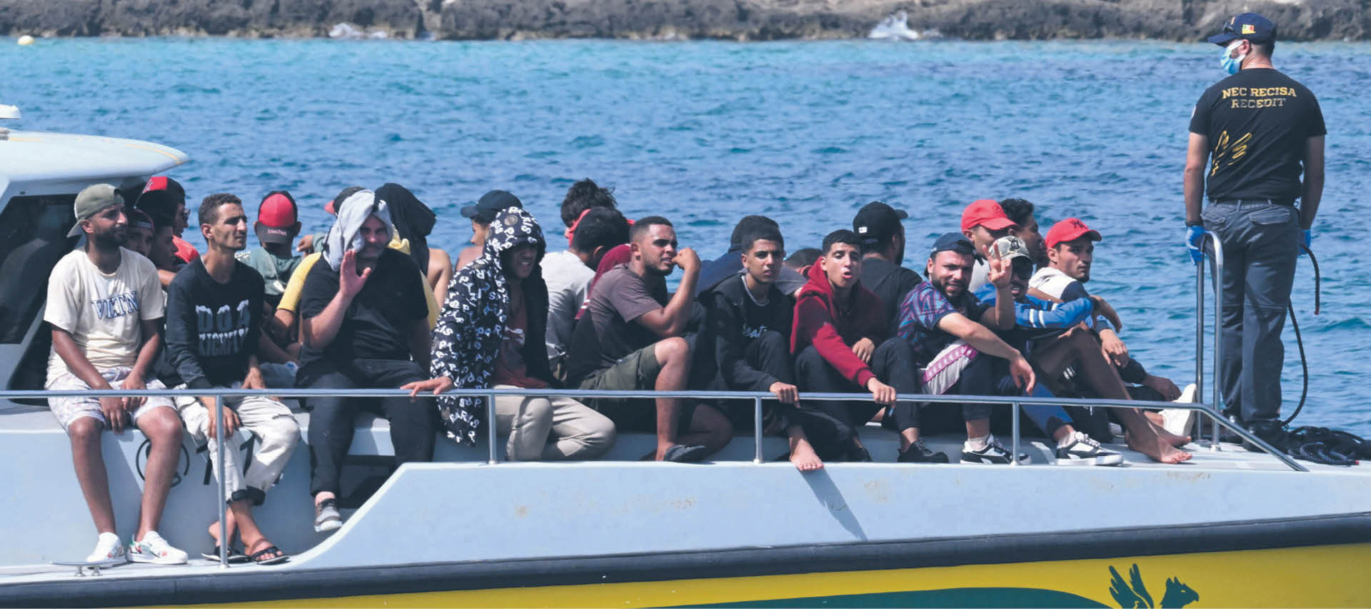 Migranci przybyli na włoską Lampedusę, wrzesień 2023 r.